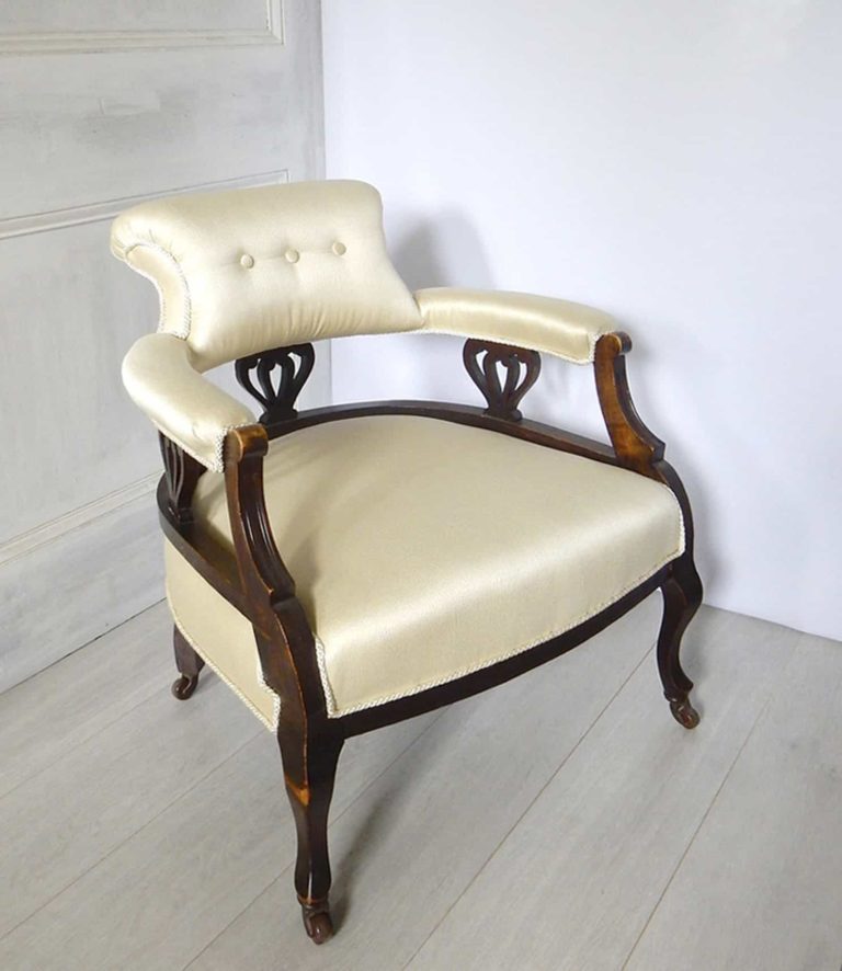 Edwardian salon tub chair upholstered in a satin oyster damask, side view.