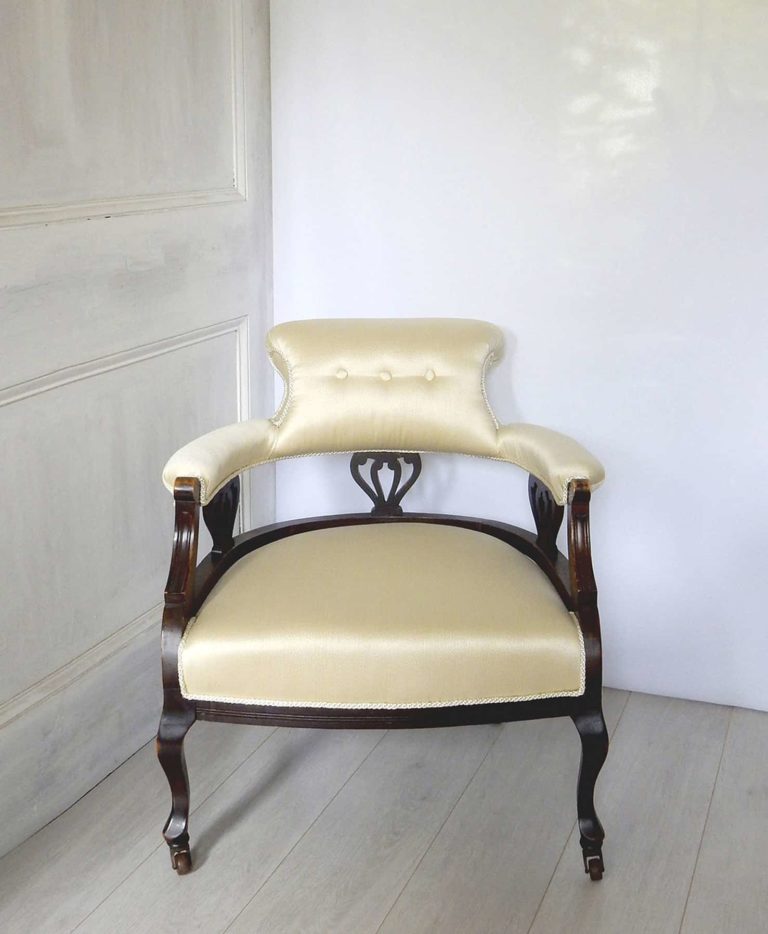 Edwardian salon tub chair upholstered in a satin oyster damask.