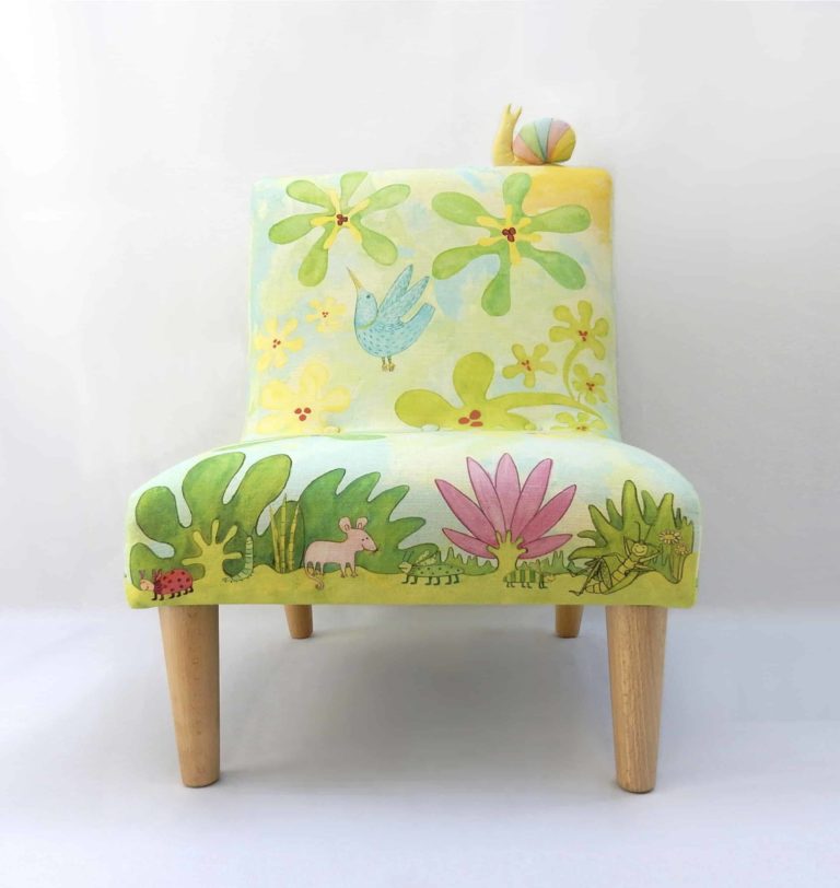 Little chair with printed fabric of cute animals, bugs, birds, leaves, flowers in blues and greens.