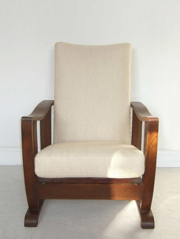 Arts & Crafts oak reclining armchair: newly upholstered in an oatmeal coloured basket weave fabric