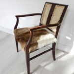 Edwardian mahogany cane back chair; goat hair on hide seat in brown and cream.