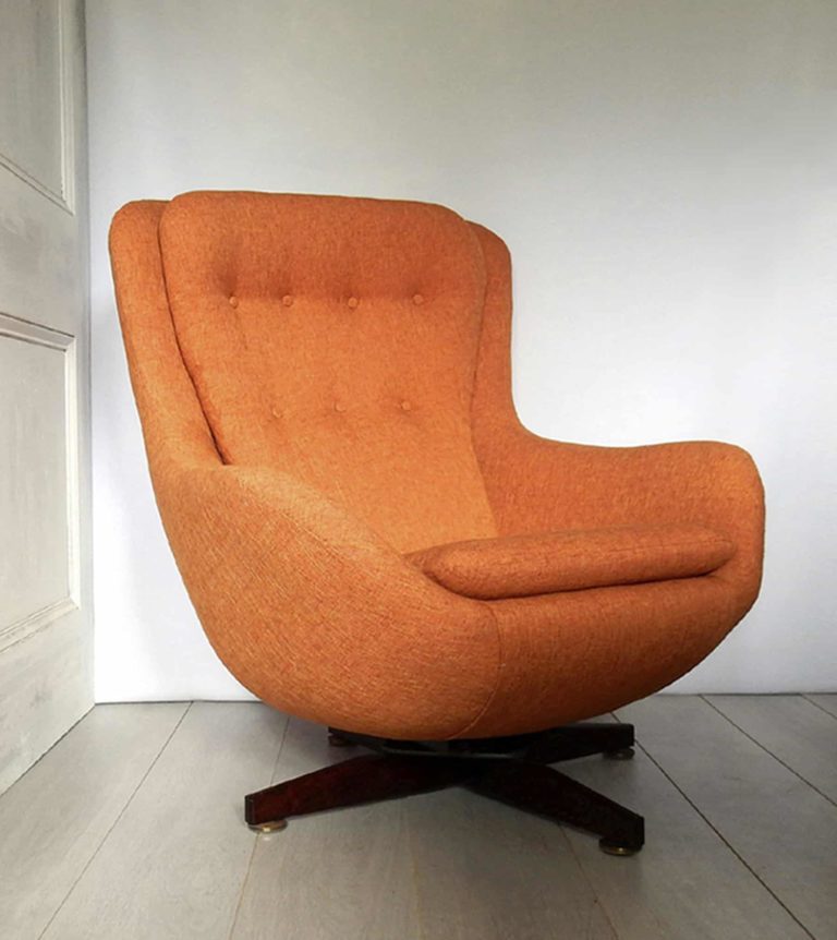 1970s retro G-Plan swivel chair; newly upholstered in orange fabric.