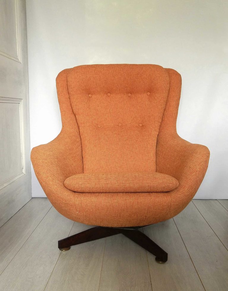 1970s retro G-Plan swivel chair; newly upholstered in orange fabric.