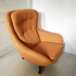 1970s retro G-Plan swivel chair; newly upholstered in orange fabric- top view.