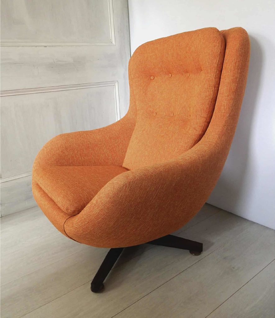 1970s retro G-Plan swivel chair; newly upholstered in orange fabric.