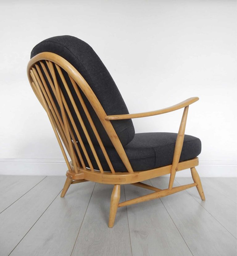 Classic Ercol 203 armchair; black wool cushion covers and sheepskin.
