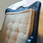 Chair upholstery, stitched hessian to chair back .