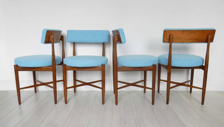 Four vintage G Plan 'Fresco' dining chair newly upholstered in a marine blue fabric by Scion fabrics.