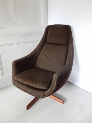 A vintage, 1970s swivel chair; brown boucle fabric; solid teak base.